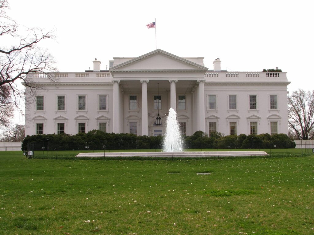 White house with fountain in front